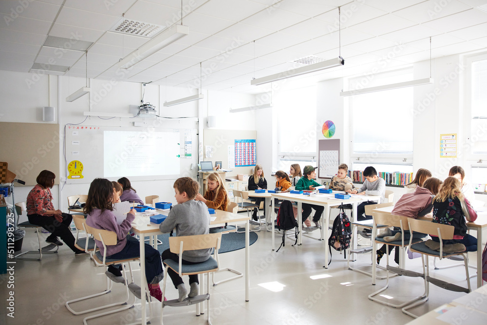 Modern K-12 classroom with students engaged in learning in a safe environment